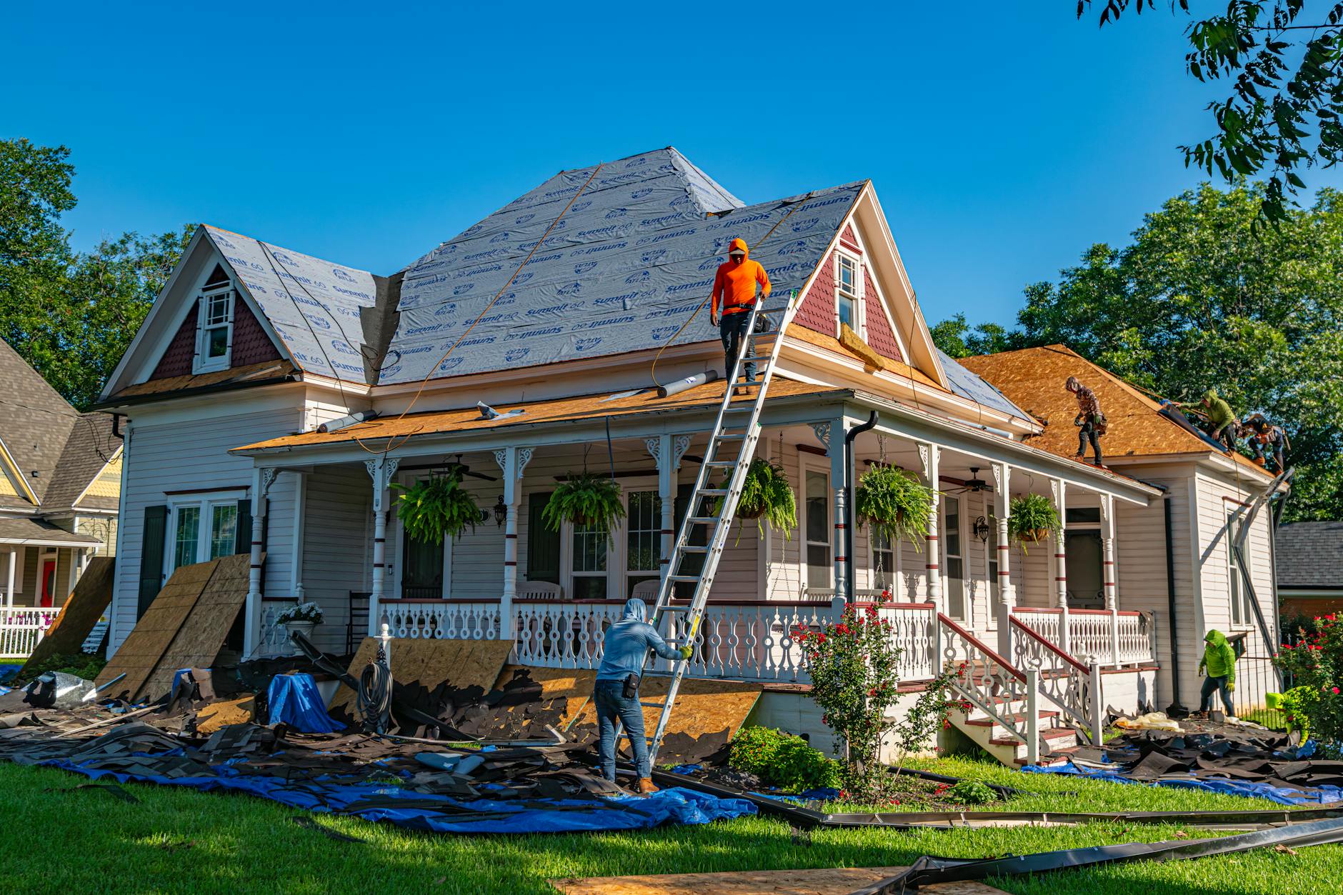 Professional photograph of a residential roof in Tucson Arizona showing split comparison between different roofing materials